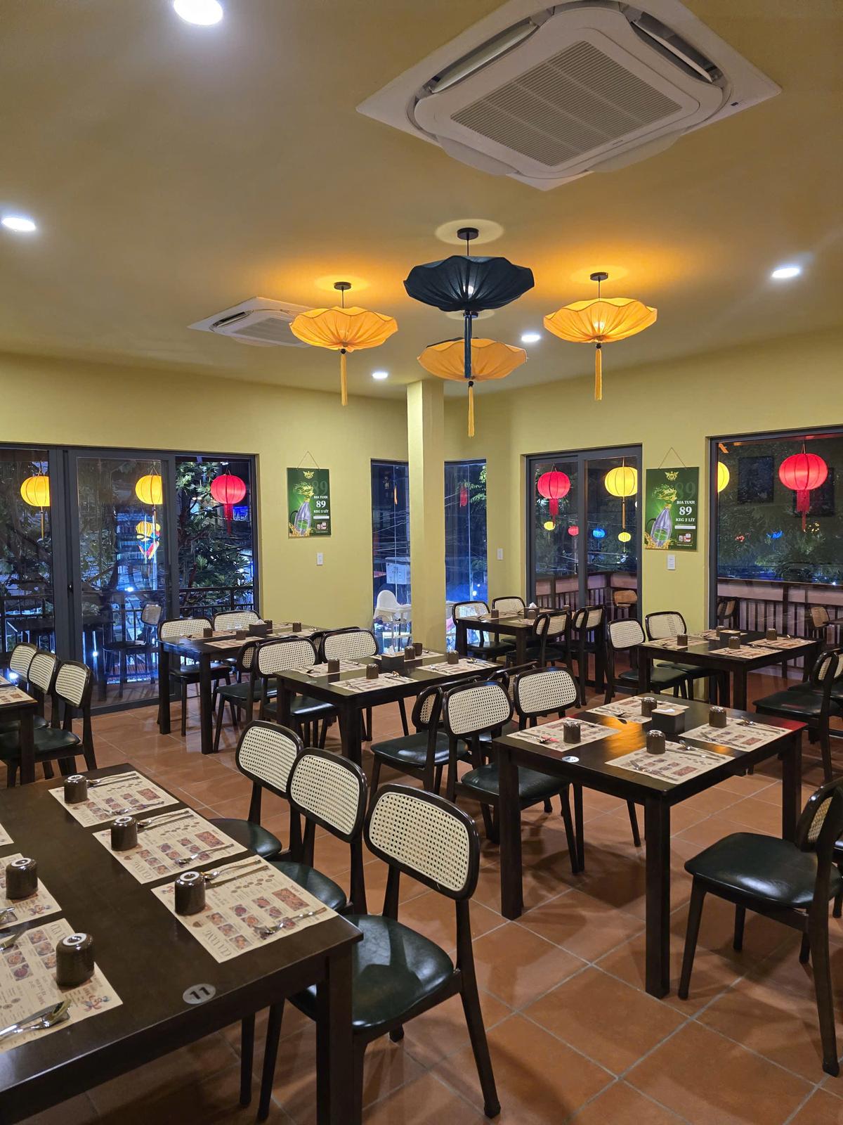 Air-conditioned interior of CUA VANG Seafood restaurant Hoi An Vietnam — comfortable dining space