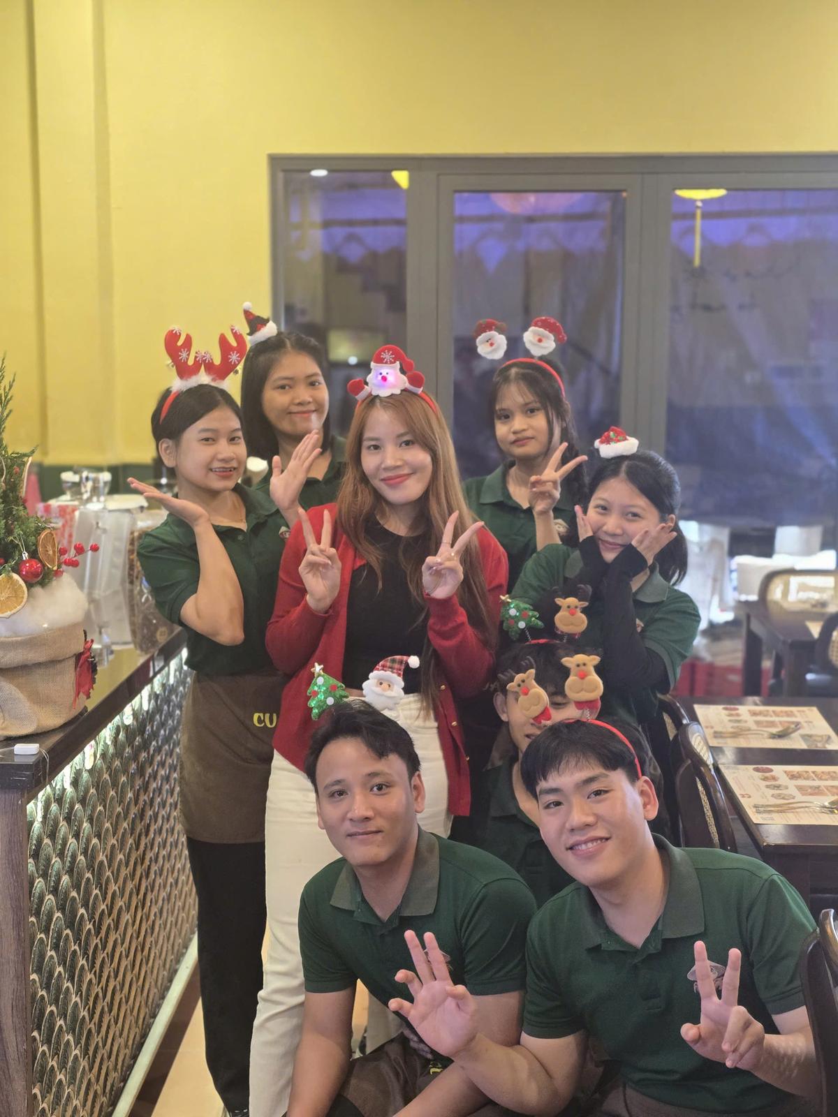 Friendly staff team at CUA VANG Seafood restaurant Hoi An